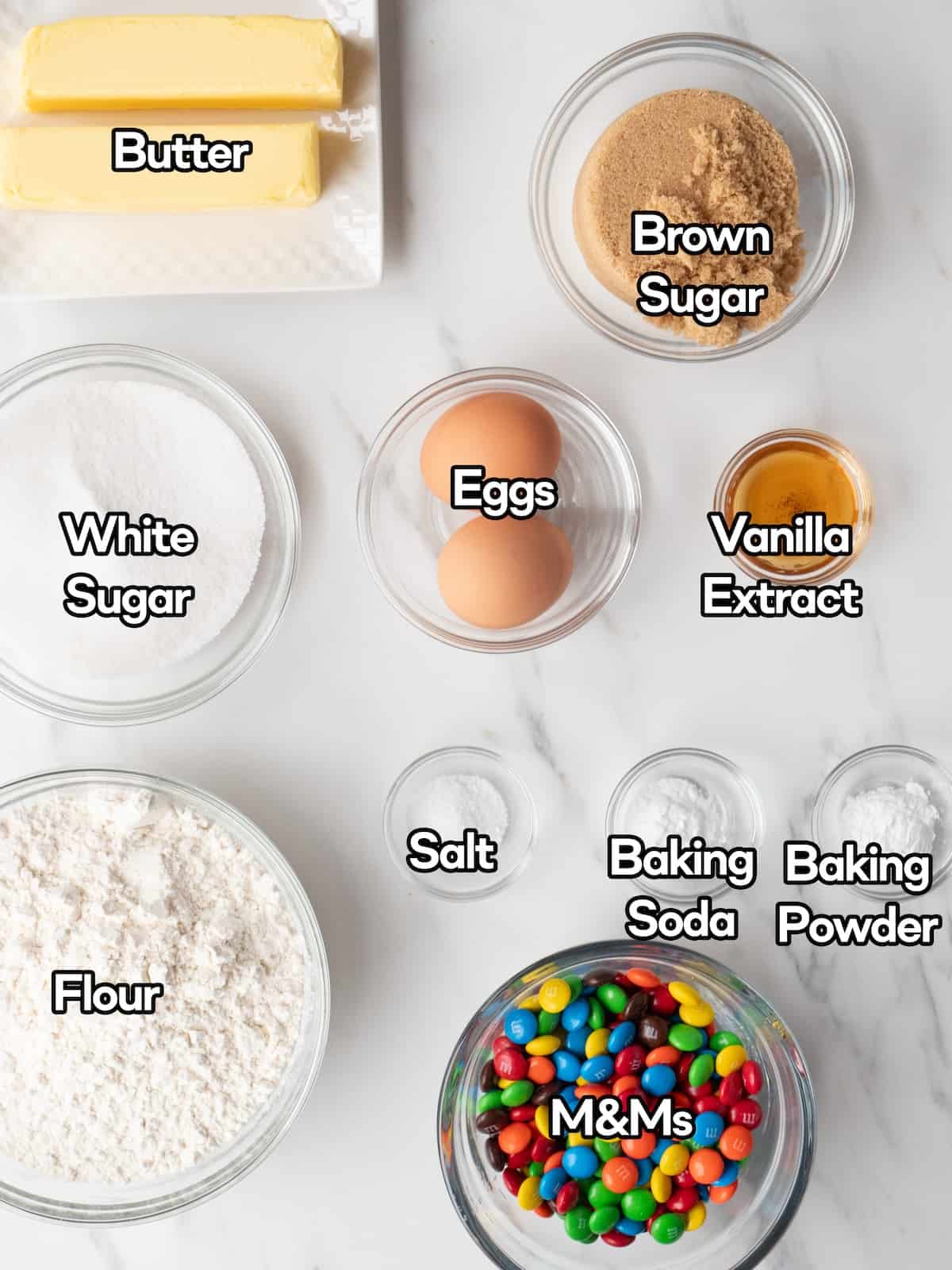 Mise en place of all the ingredients for making giant M&M cookies.