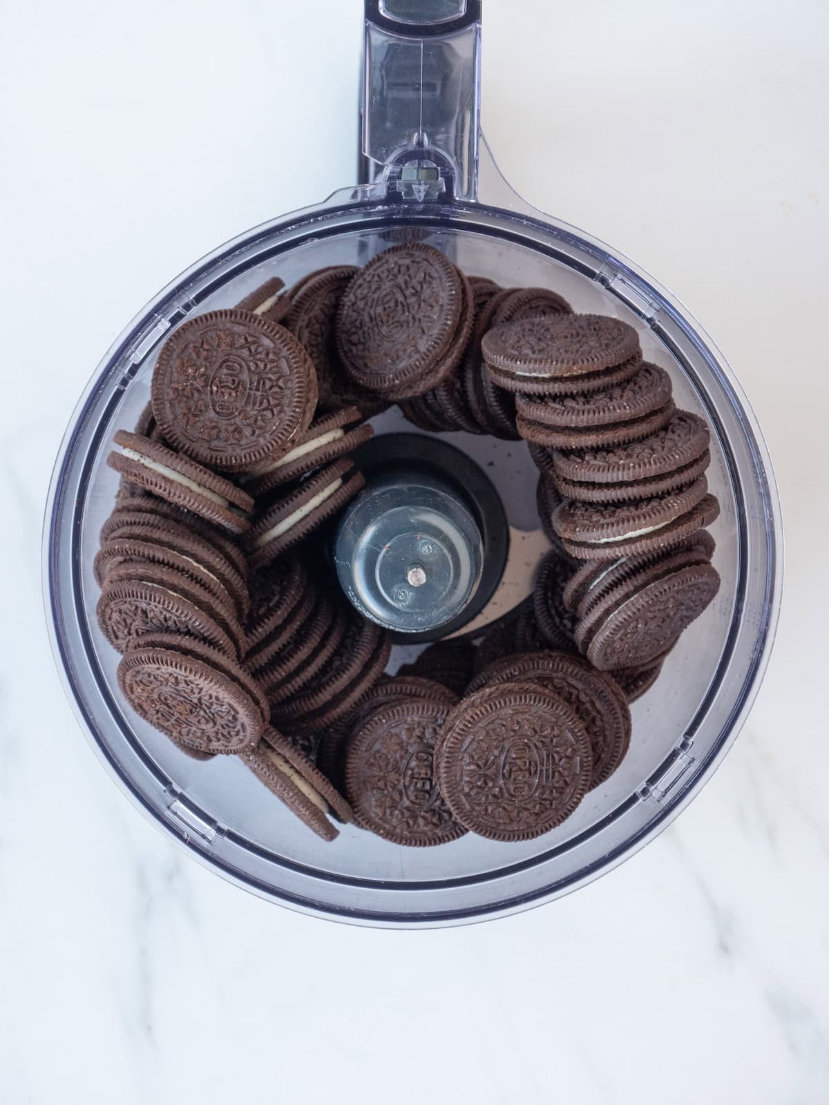 A food processor blender with oreos.
