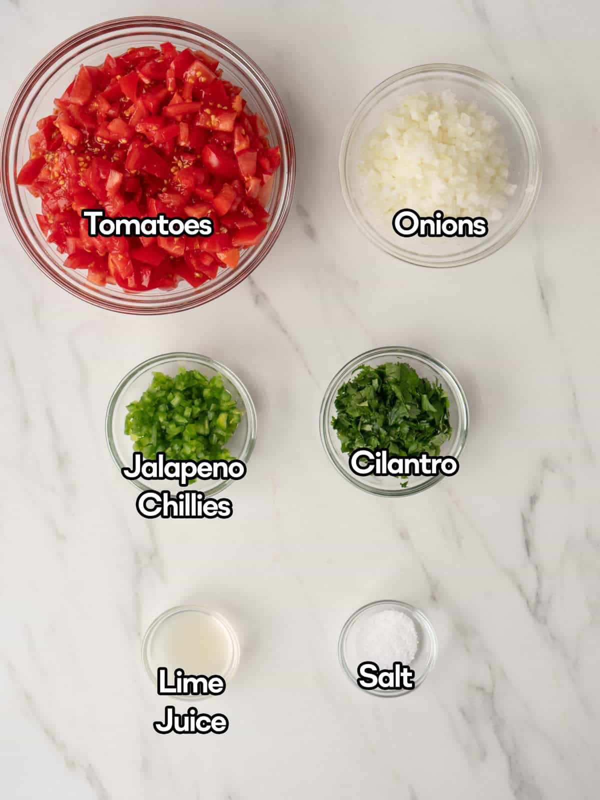 Mise en place of all ingredients to make pico de gallo.