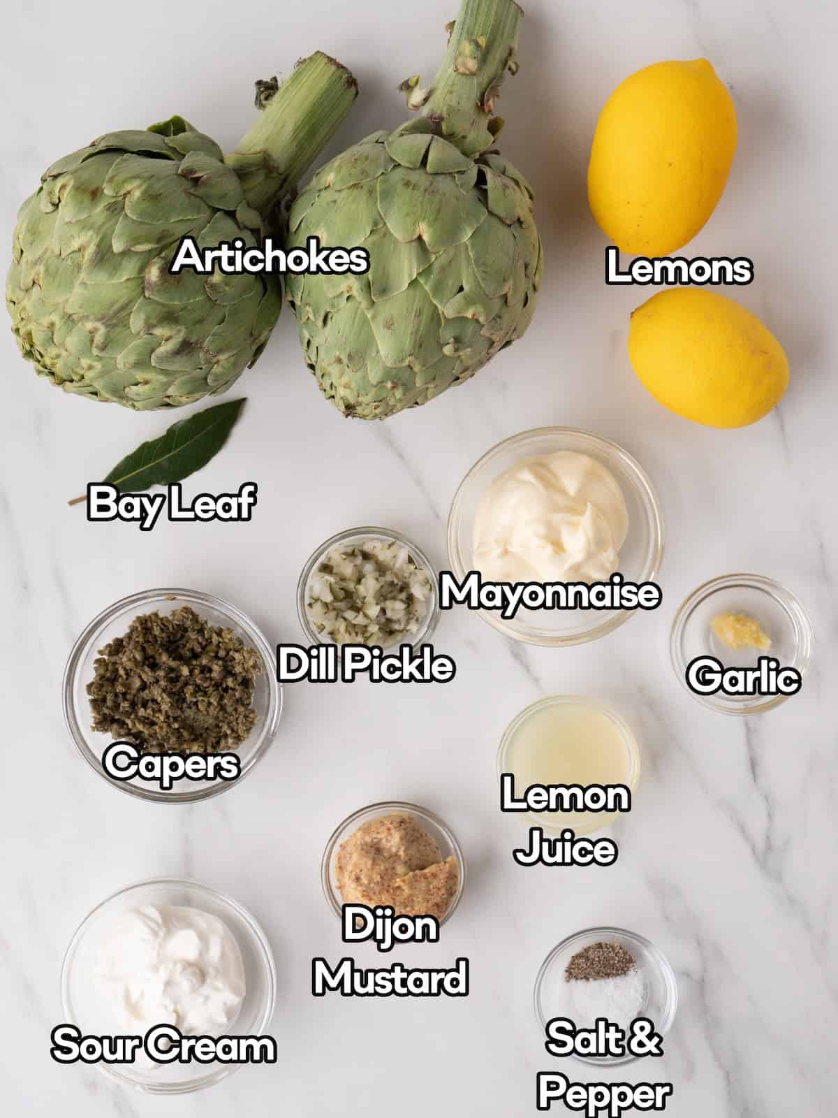 Mise en place of all ingredients to make steamed artichokes.