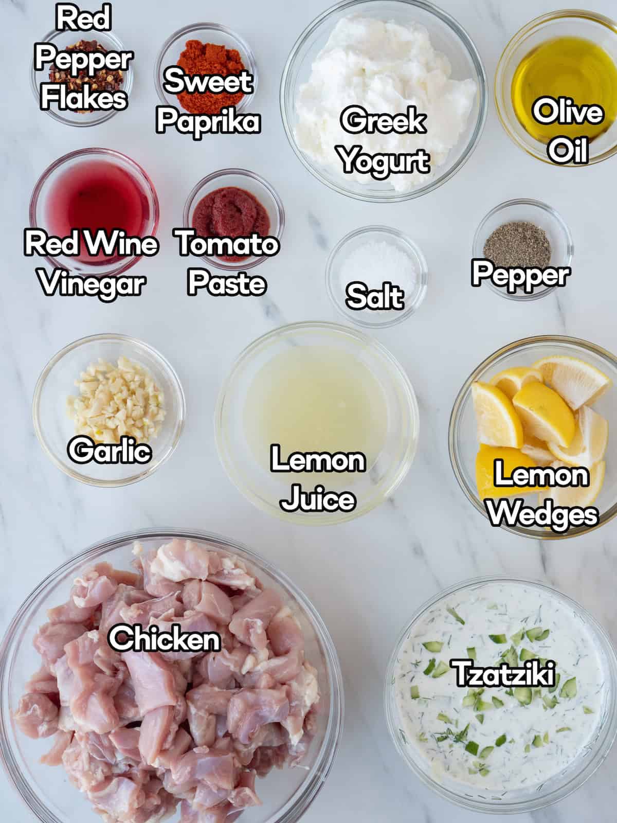 Mise en place of all ingredients to make yogurt marinated grilled chicken skewers.