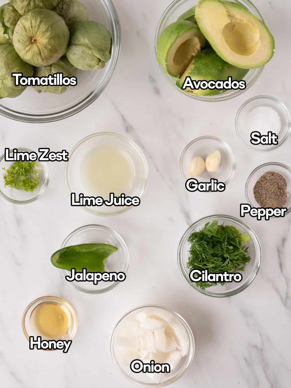 Mise en place of all ingredients to make tomatillo avocado salsa.