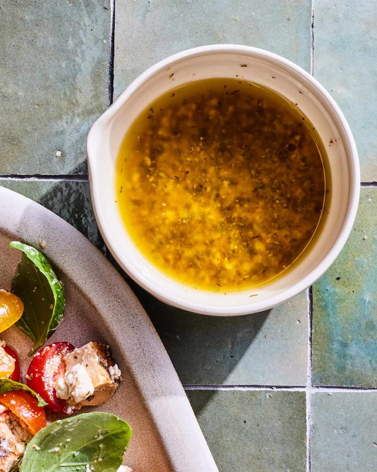 A close up of a creamy feta dressing with Tuscan spices