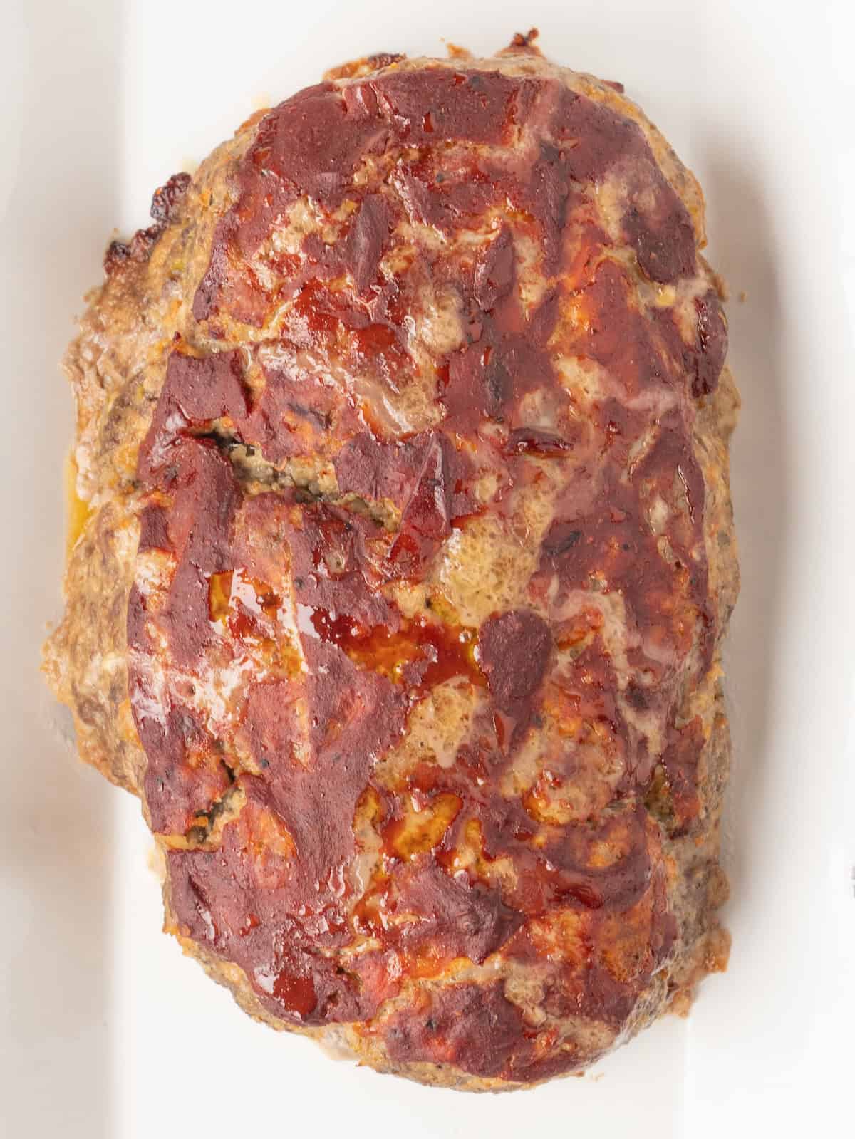 A closeup overhead shot of a baked BBQ style meatloaf.