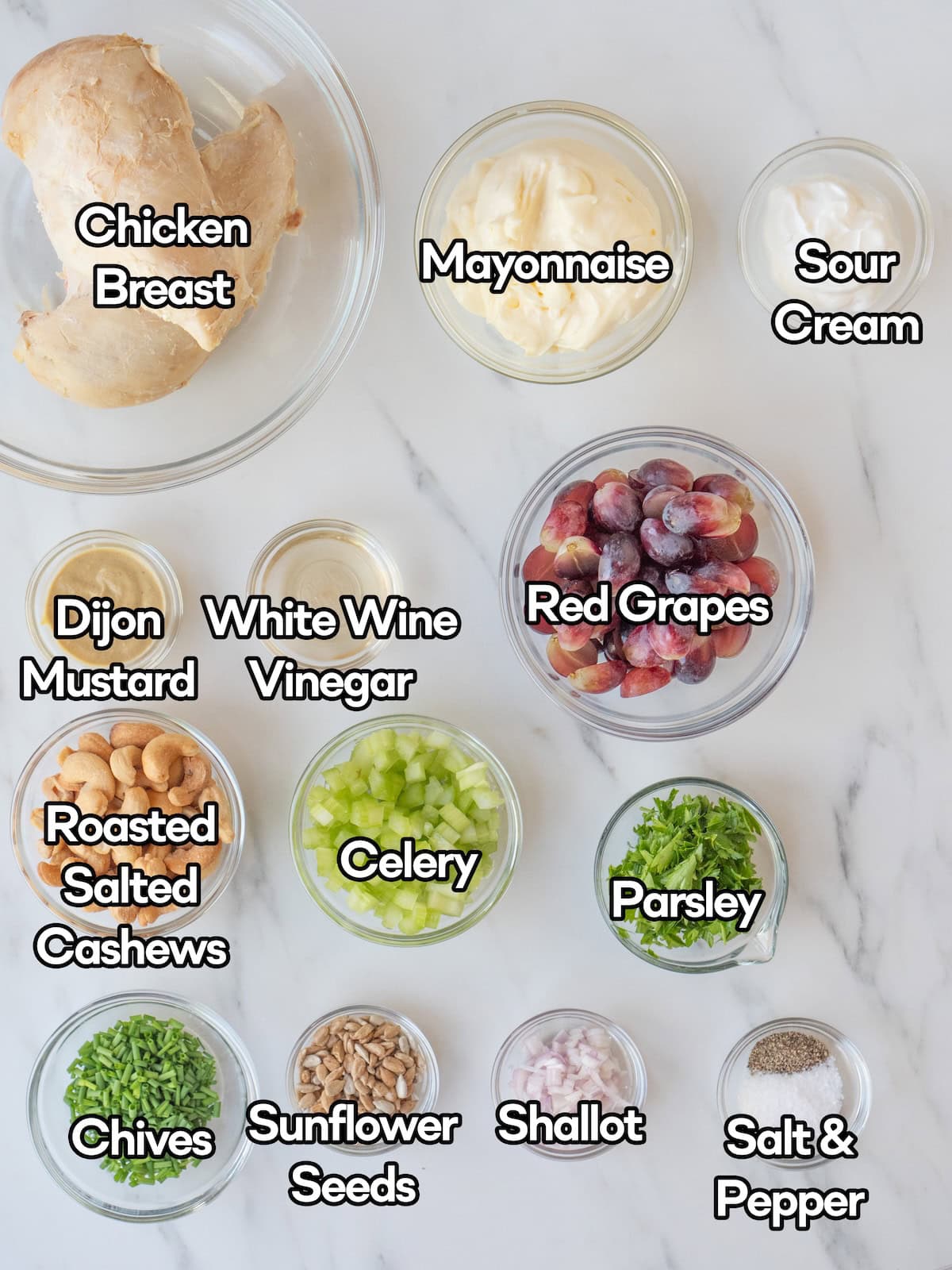 Mise en place of all ingredients to make creamy herb chicken salad.