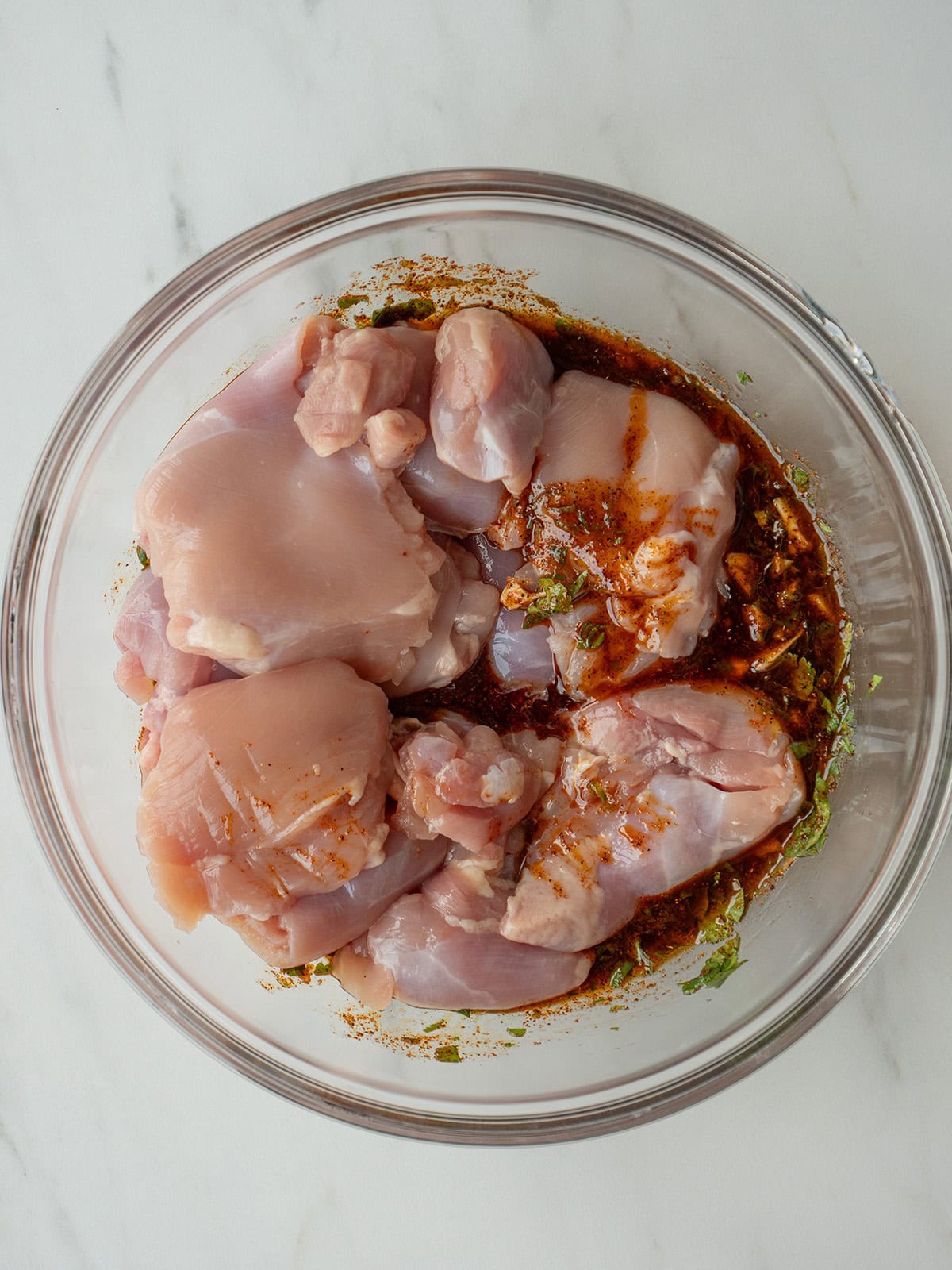 Raw chicken marinated in spices.