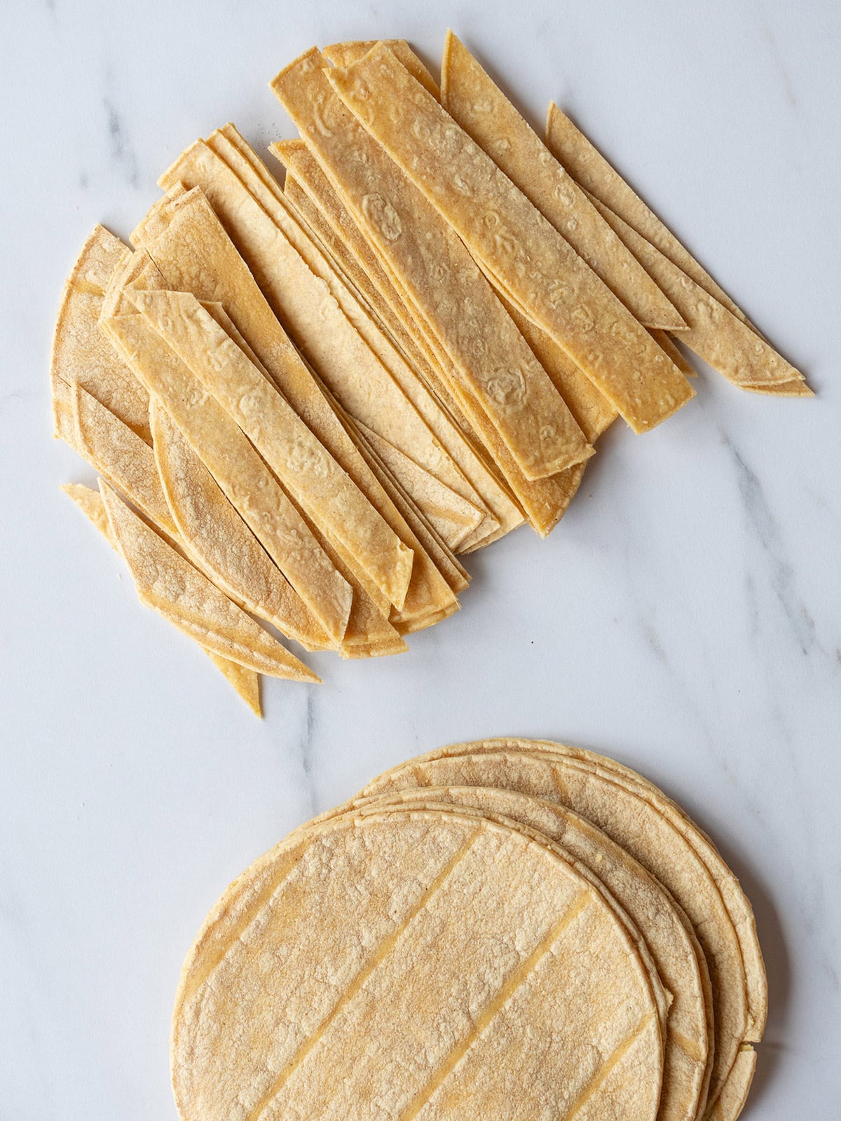 Stacked tortillas and cut strips.