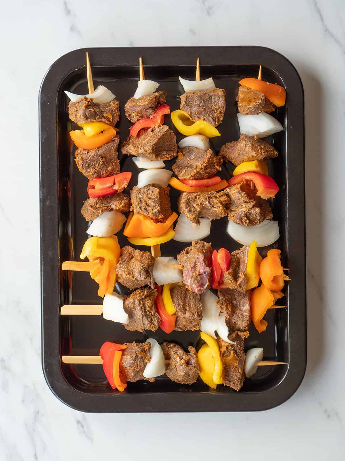 Colorful beef kebabs on skewers