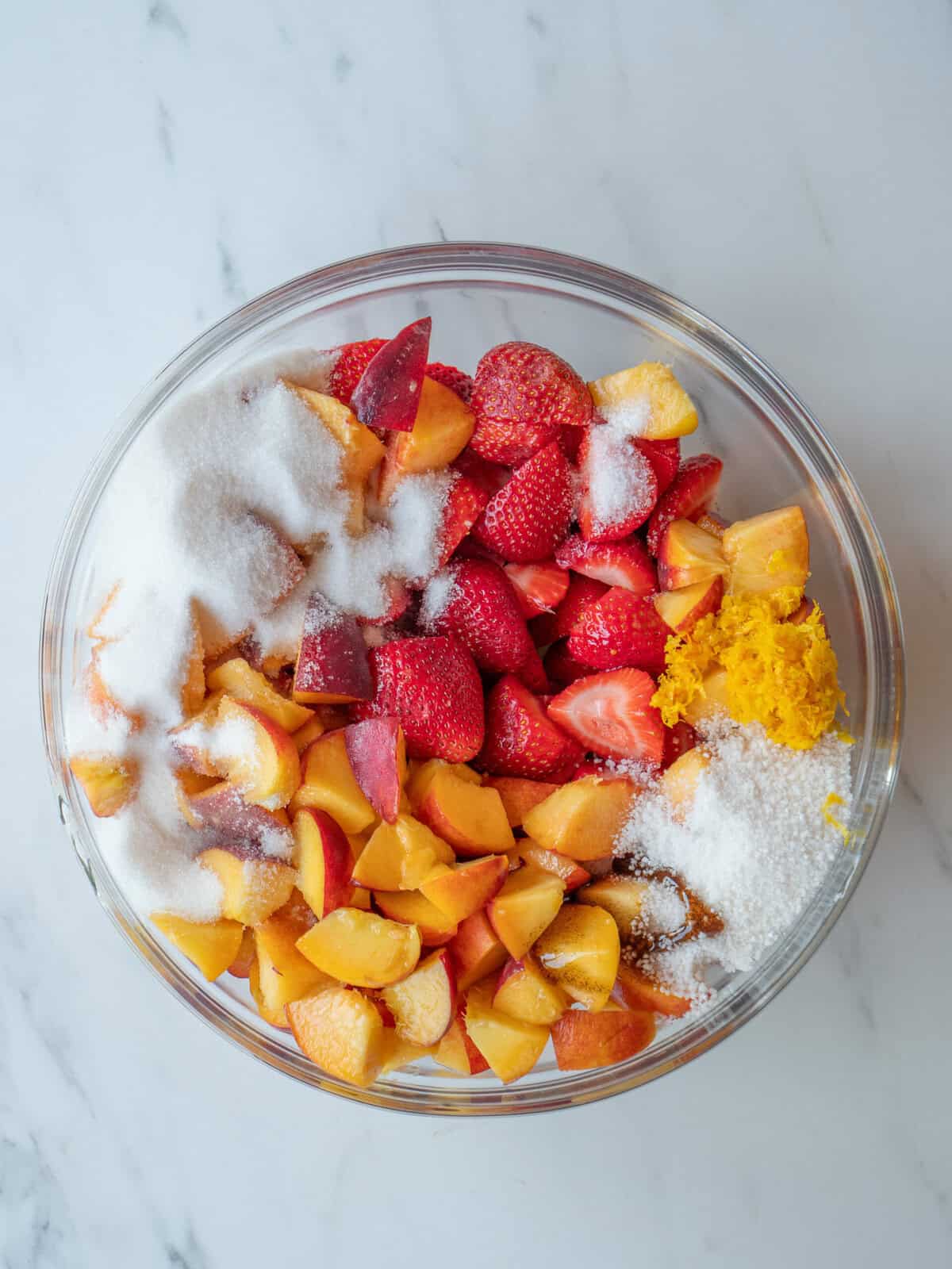Bowl of mixed fruits and sugar