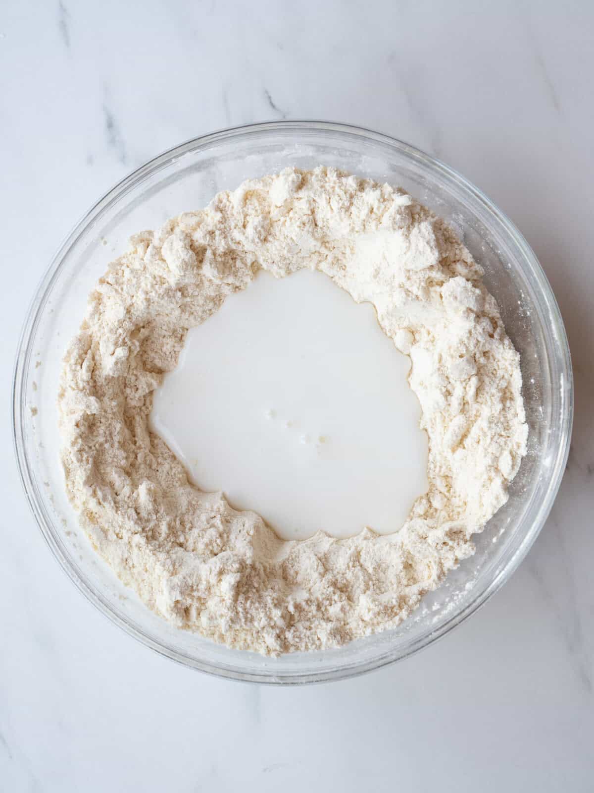 Bowl of flour with buttermilk center
