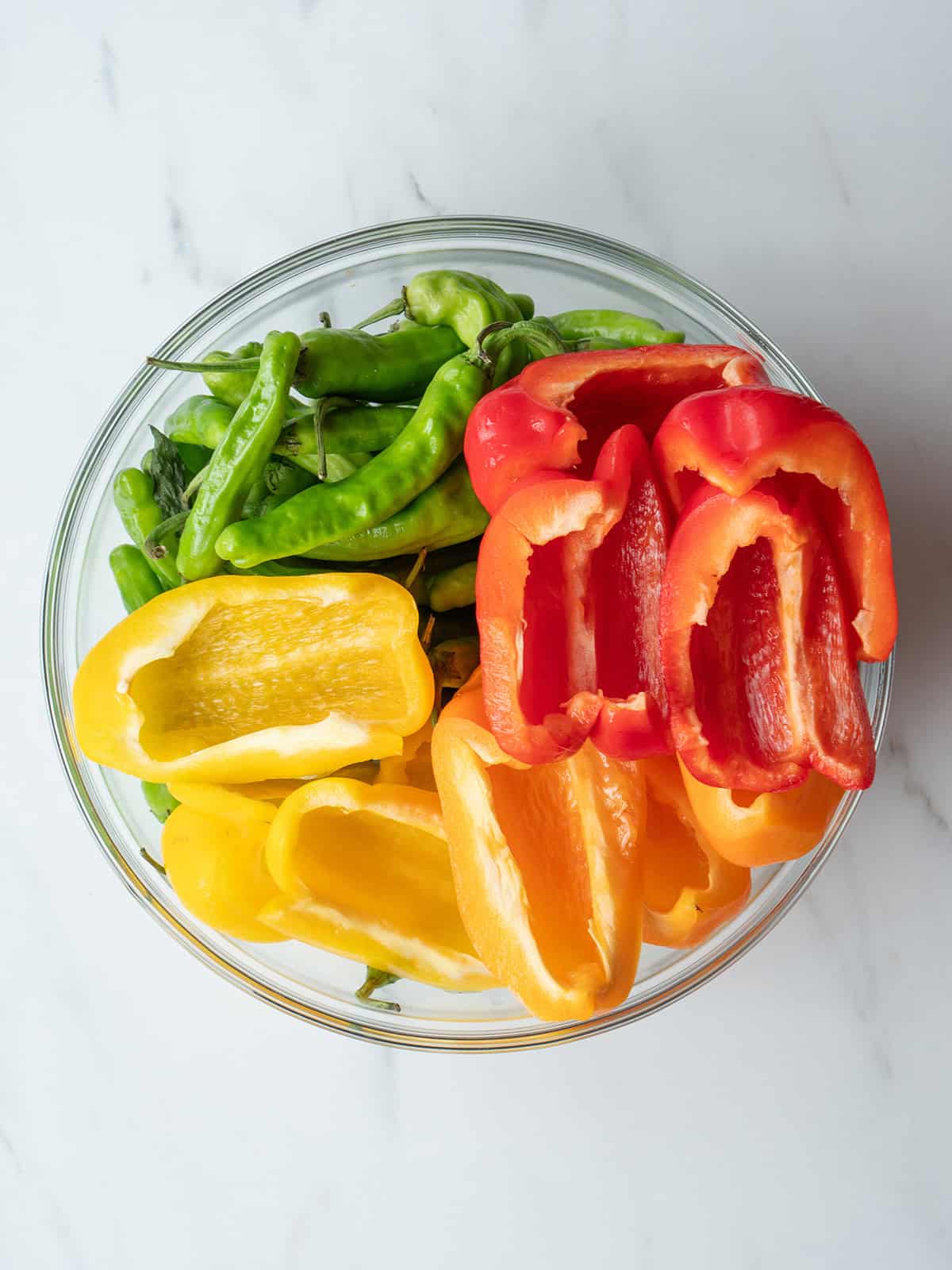Colorful peppers in a glass bowl