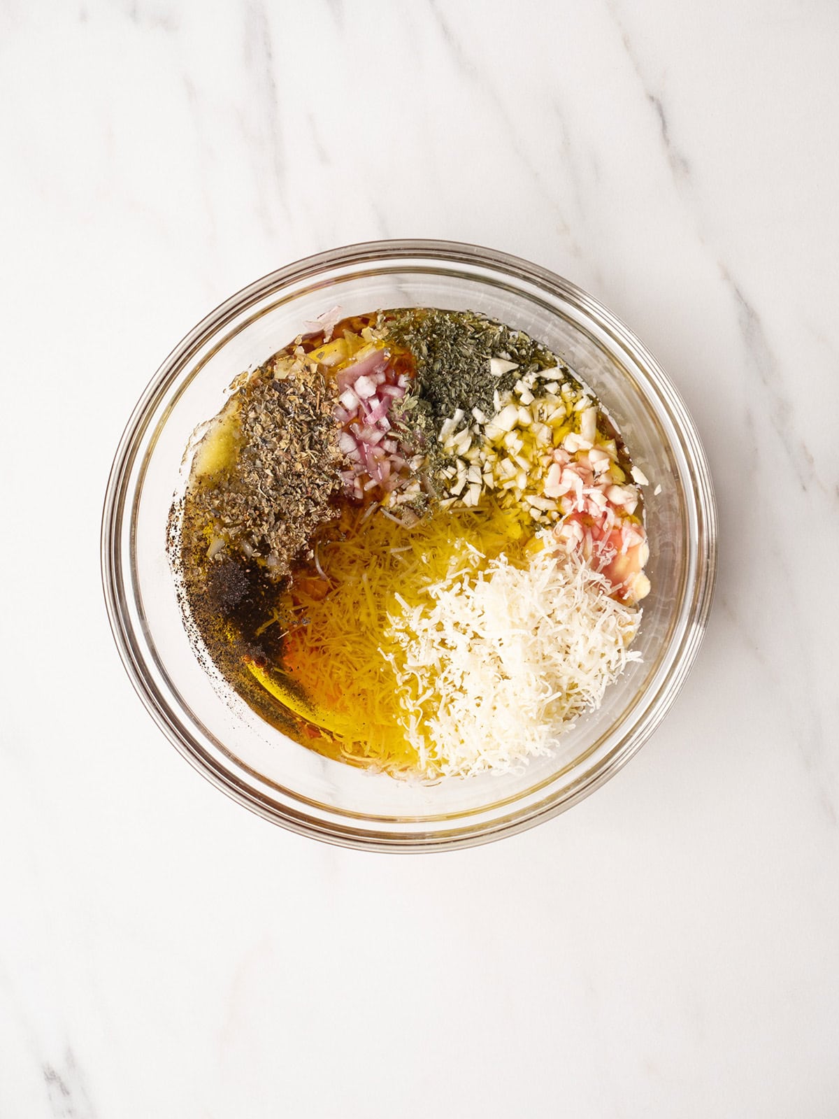 Ingredients for a Mustard Herb Vinaigrette in a medium bowl for the California Cobb Salad