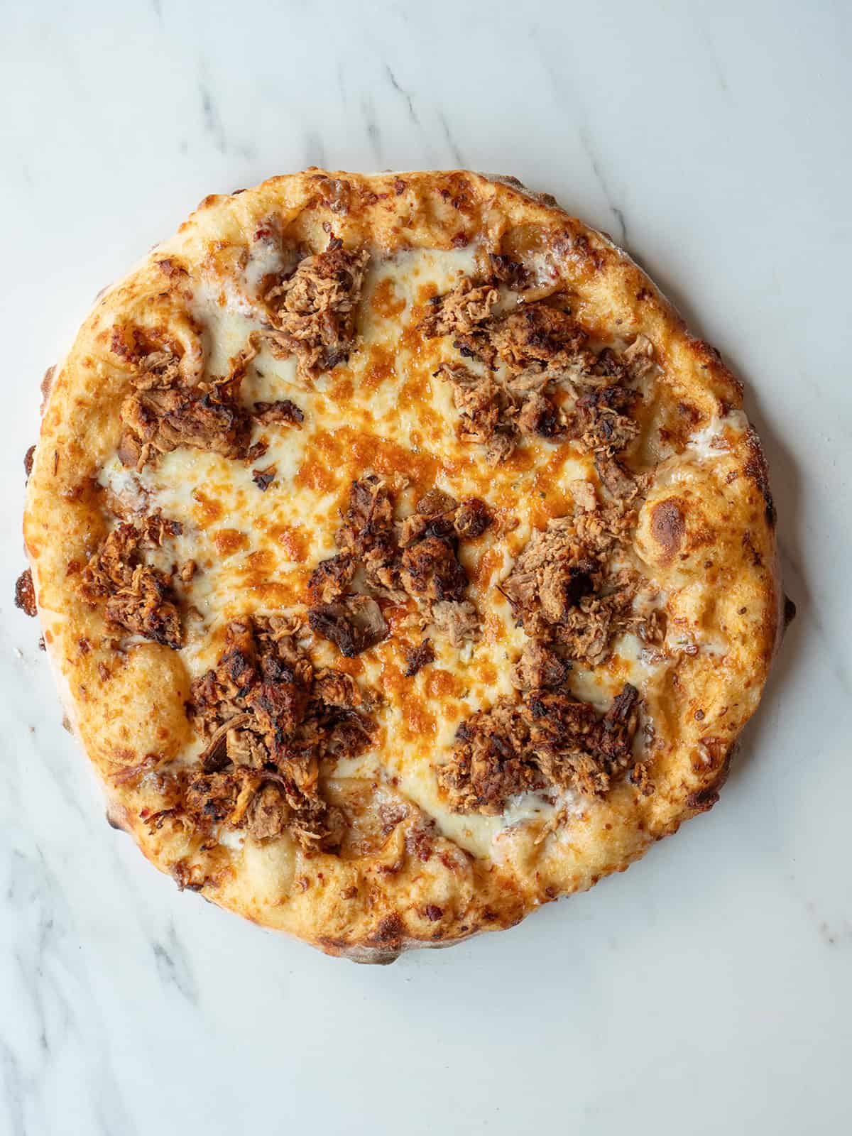 Baked Carnitas Guacamole Pizza