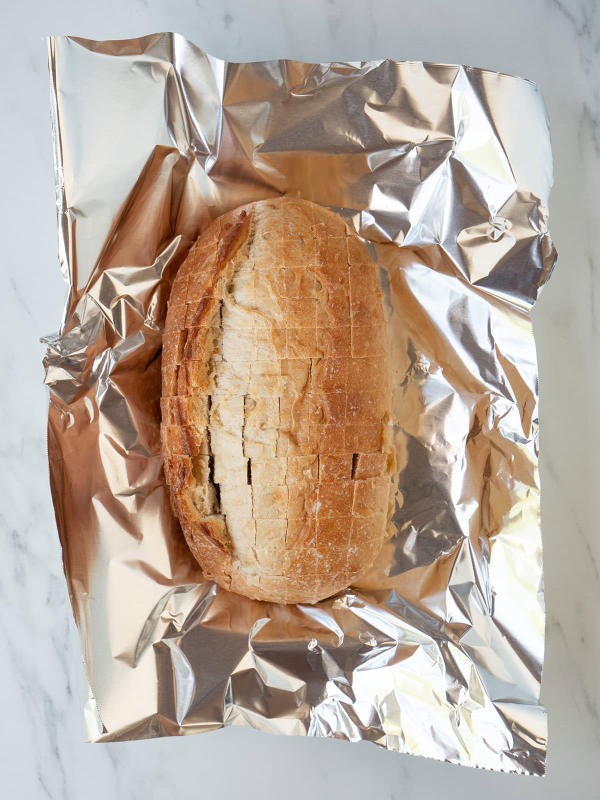 Italian Bread sliced in a crosshatch pattern