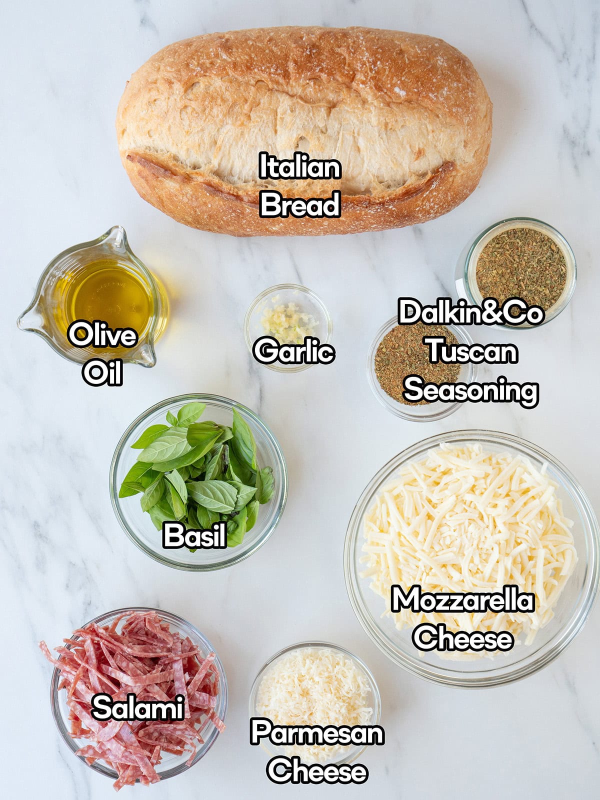 Ingredients for Cheesy Pull-Apart Bread on a kitchen surface