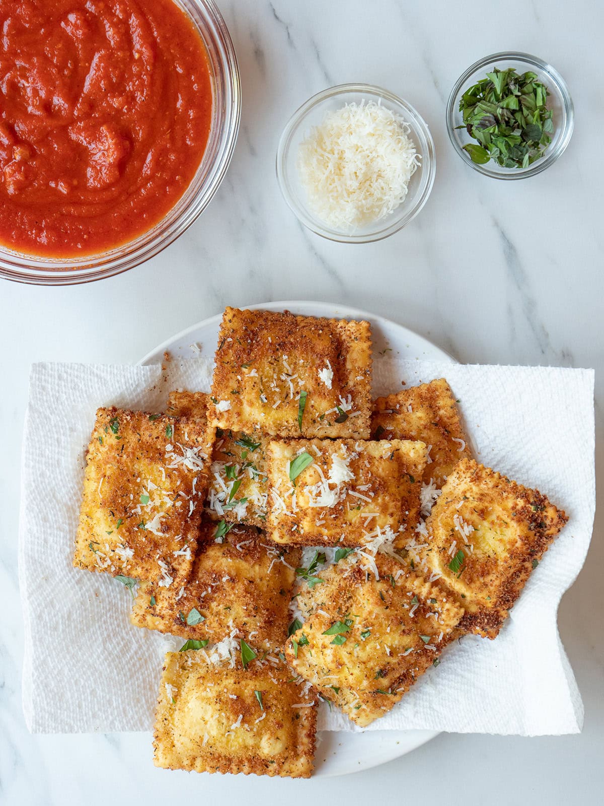 Fried ravioli served with parmesan cheese, herbs, and marinara