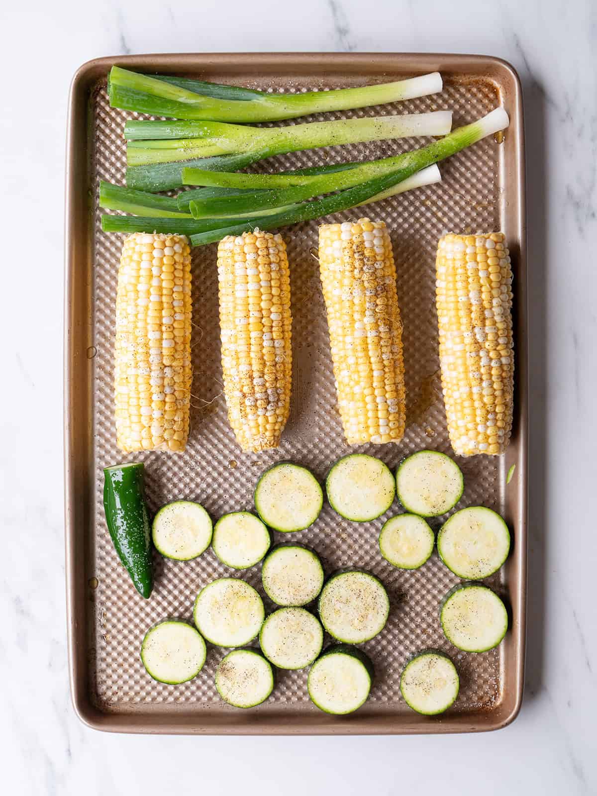 Fresh corn and zucchini on tray