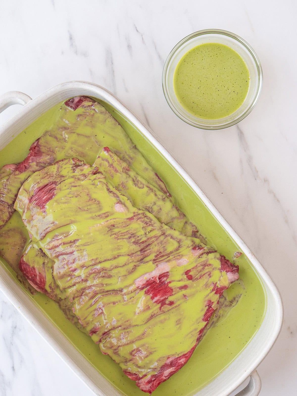 Steak in a dish with marinade