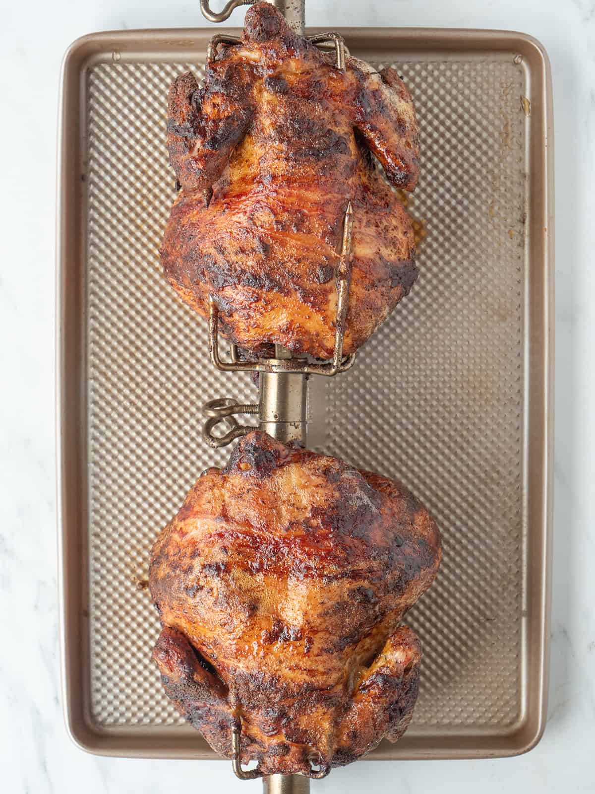 Roasted perfect rotisserie chicken on a spit