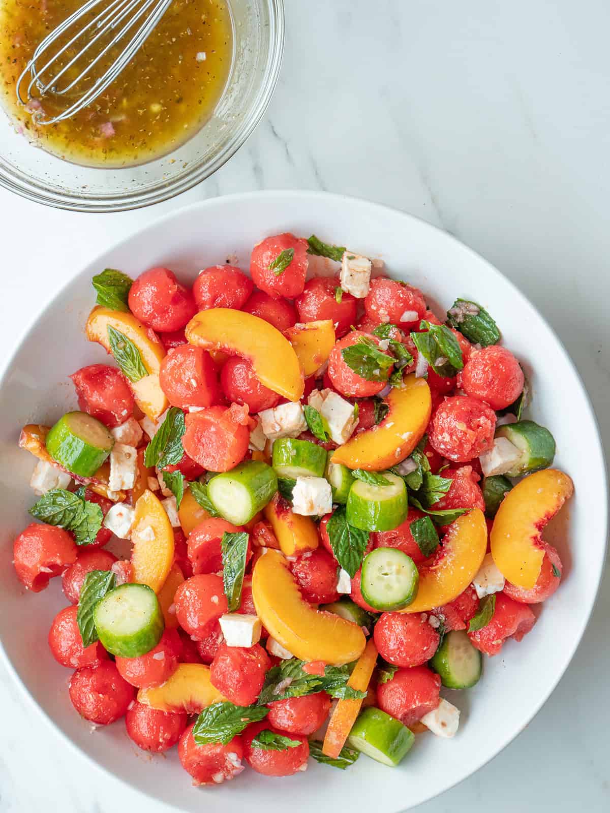 Watermelon Peach Salad topped with feta and fresh mint
