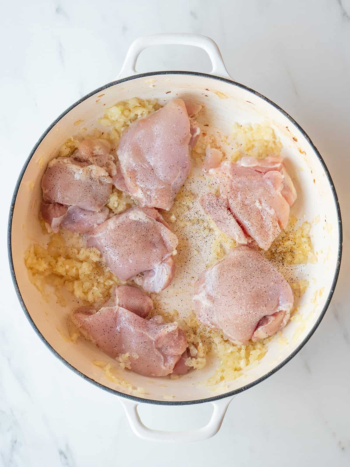 Chicken thighs browning in a Dutch oven for Pumpkin Chicken Chili