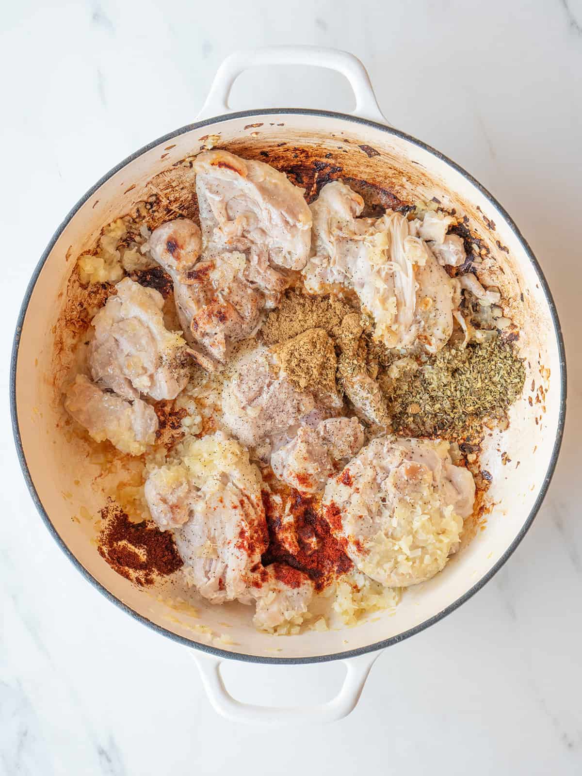Chicken and spices in a pot
