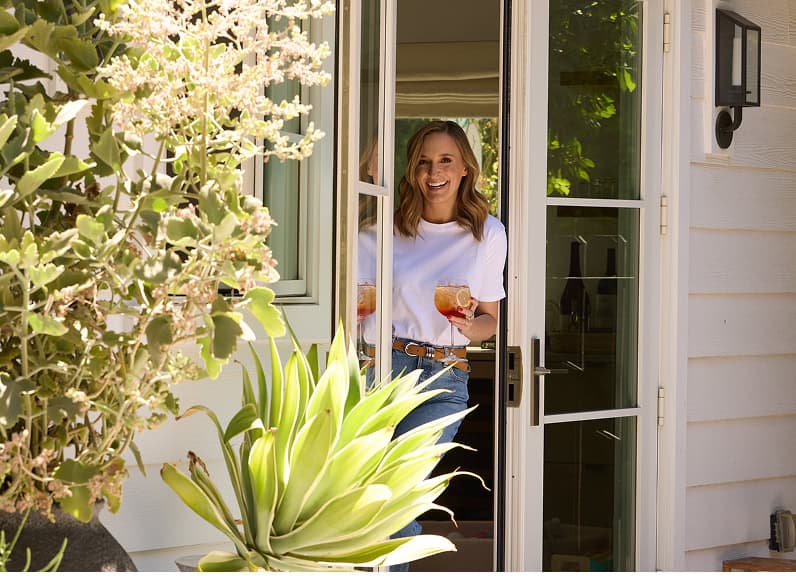 Gaby smiling looking outside