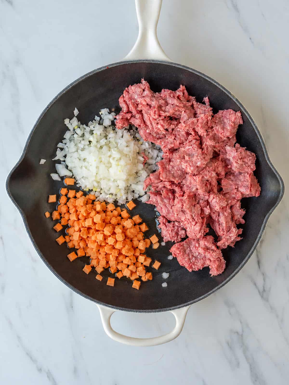 Raw ground beef with diced vegetables