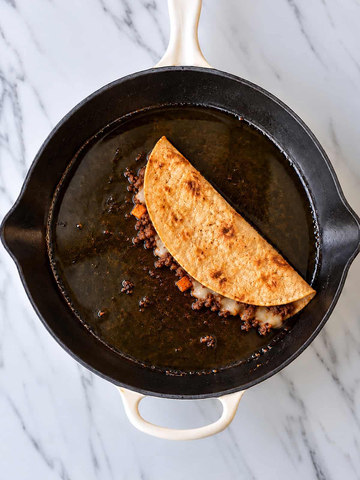 Taco in skillet with ground beef
