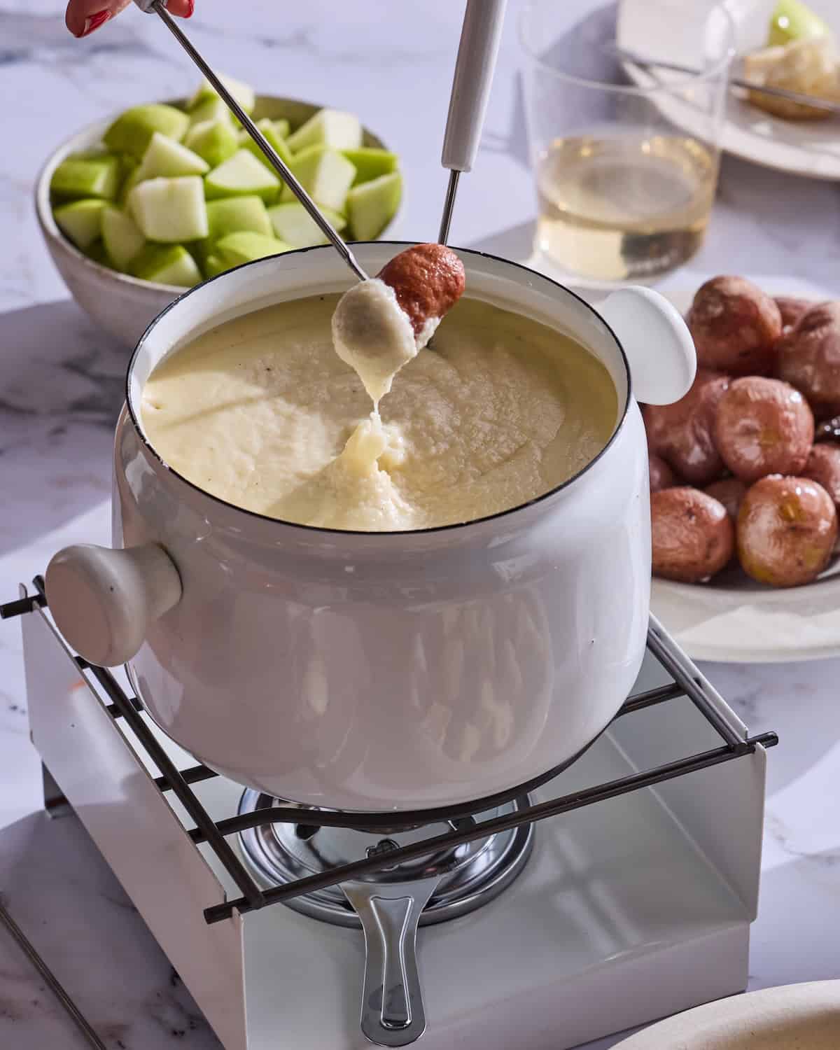 Cheese fondue with dipping items