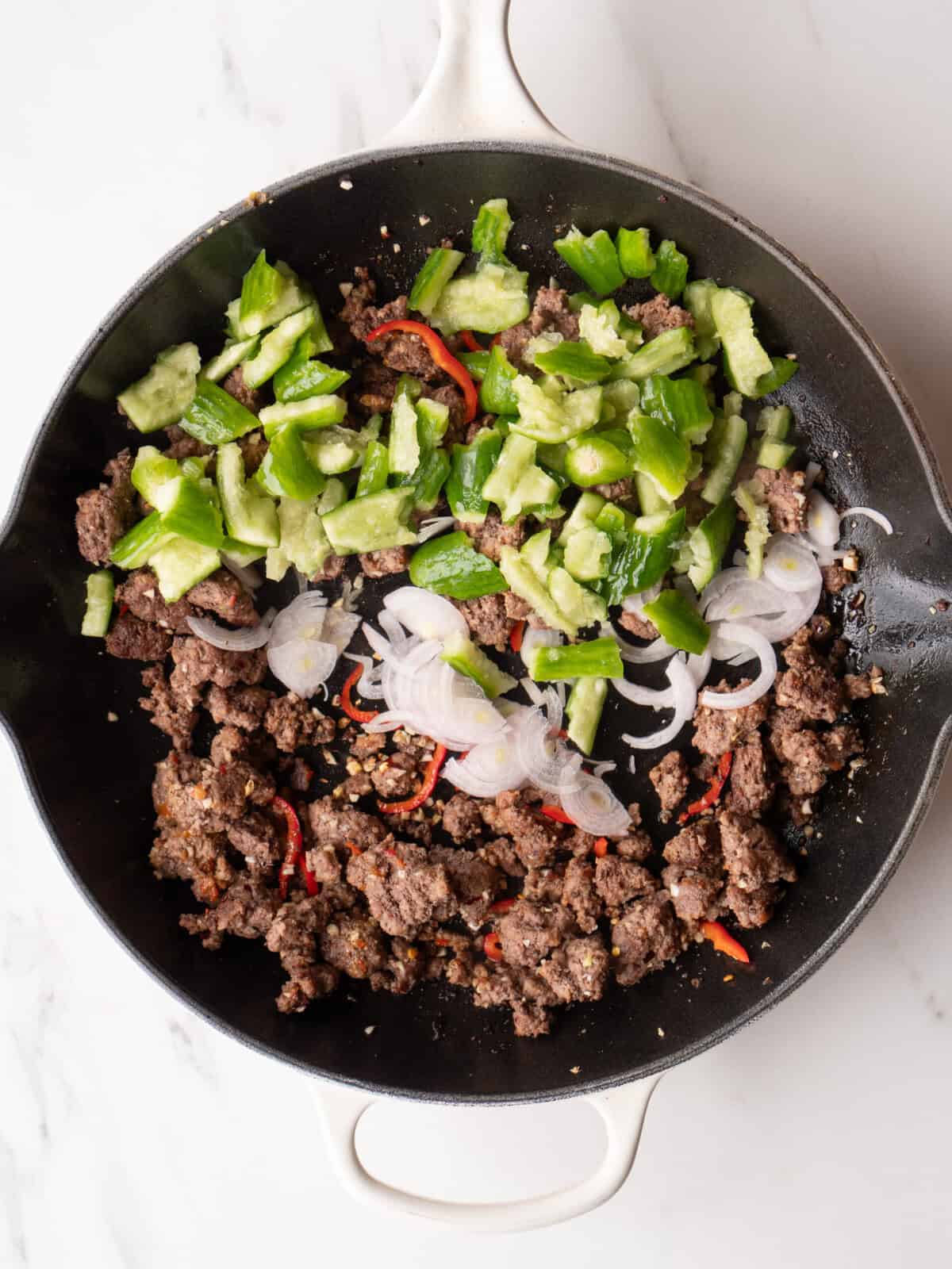 Cooked beef with vegetables in skillet