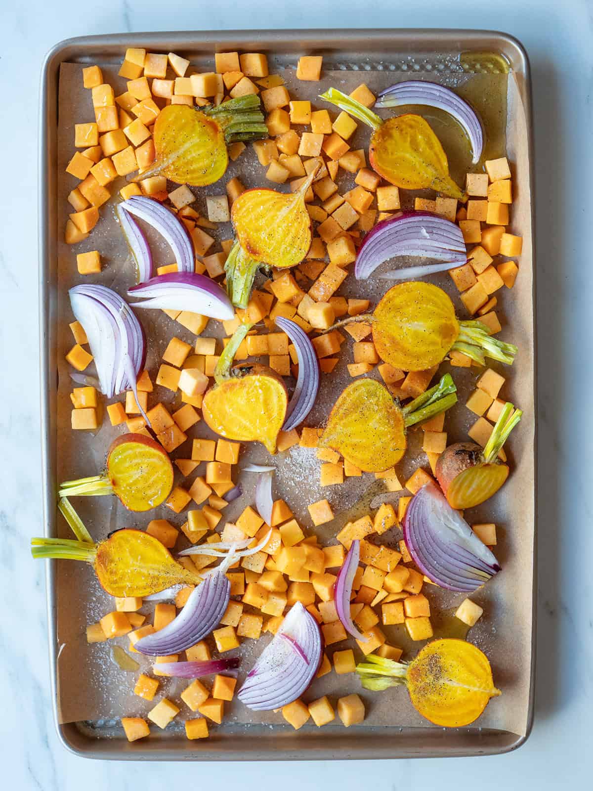 Colorful roasted vegetables on baking tray