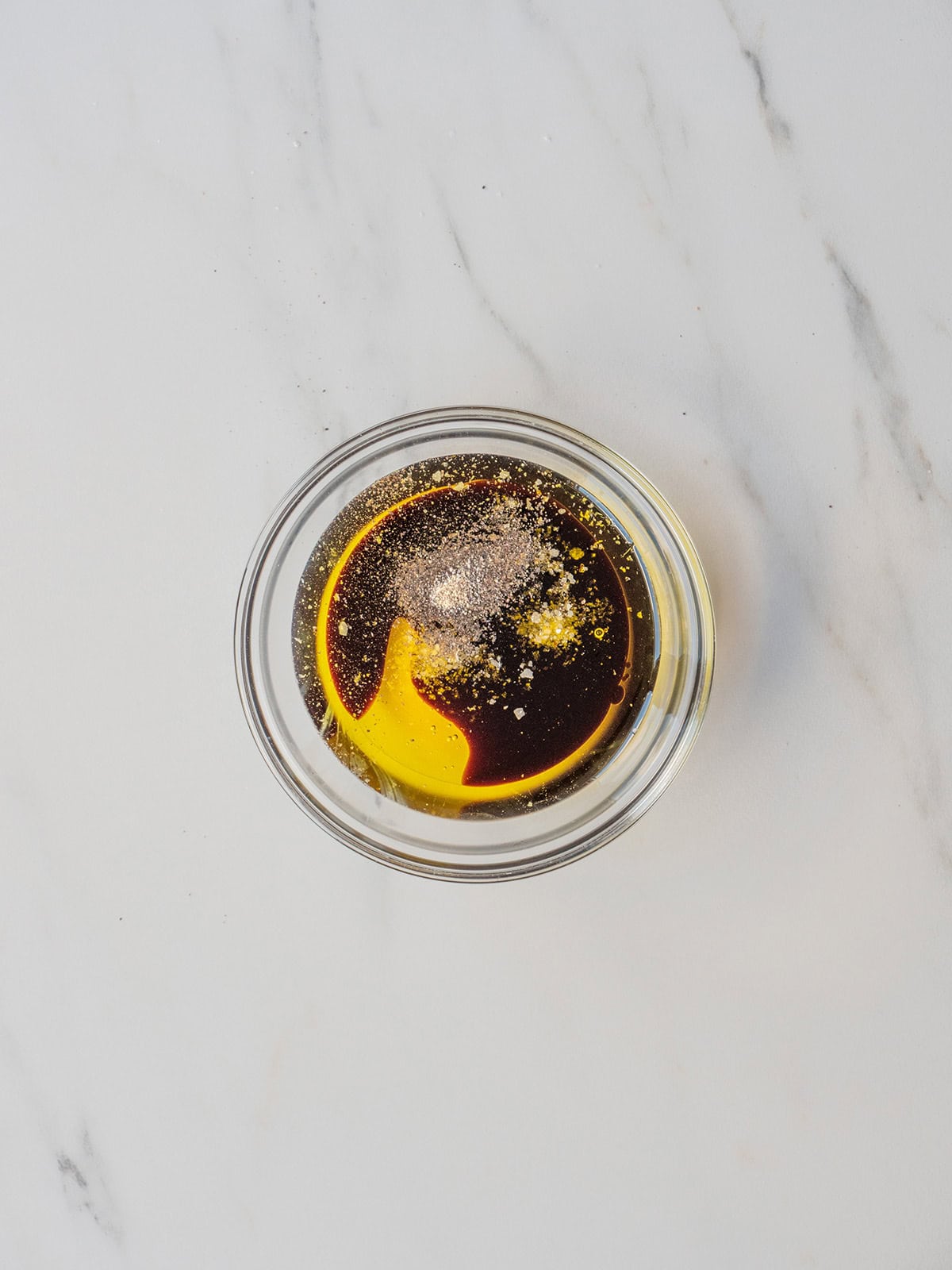 Bowl of dark liquid with spices