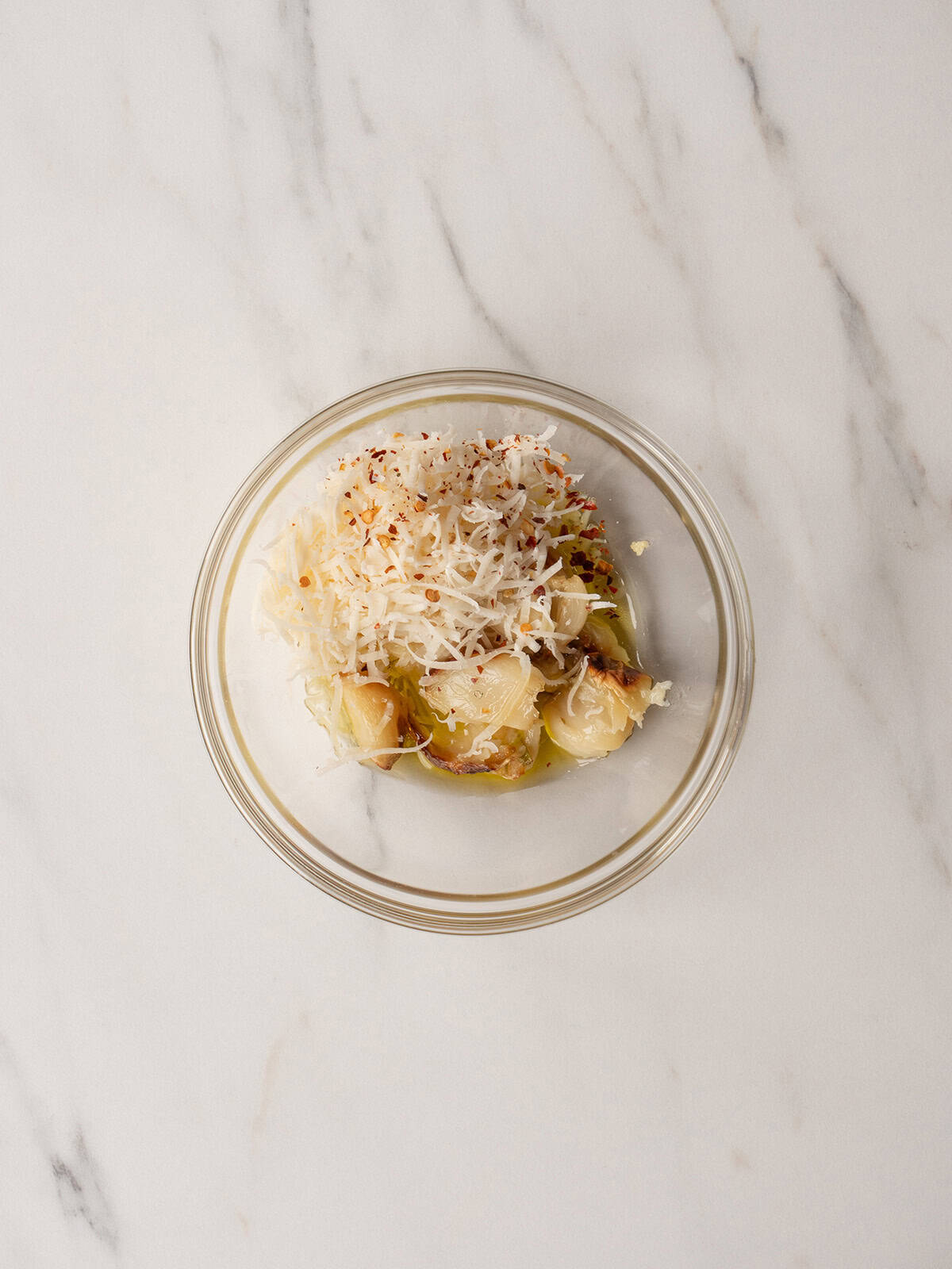 Bowl of garlic with cheese