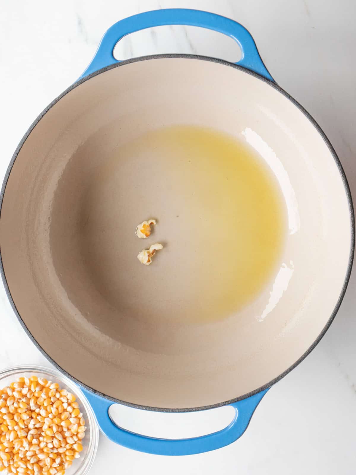 Oil and popcorn kernels in pot