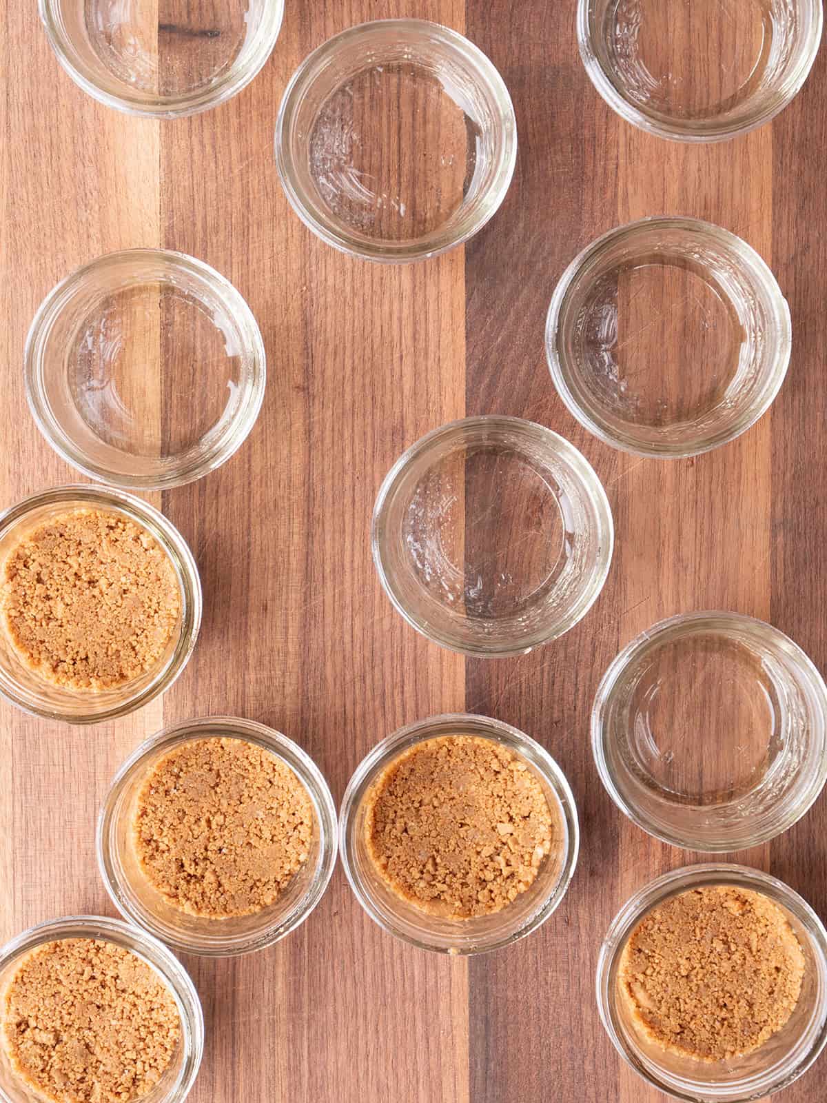 Empty jars with graham cracker crusts