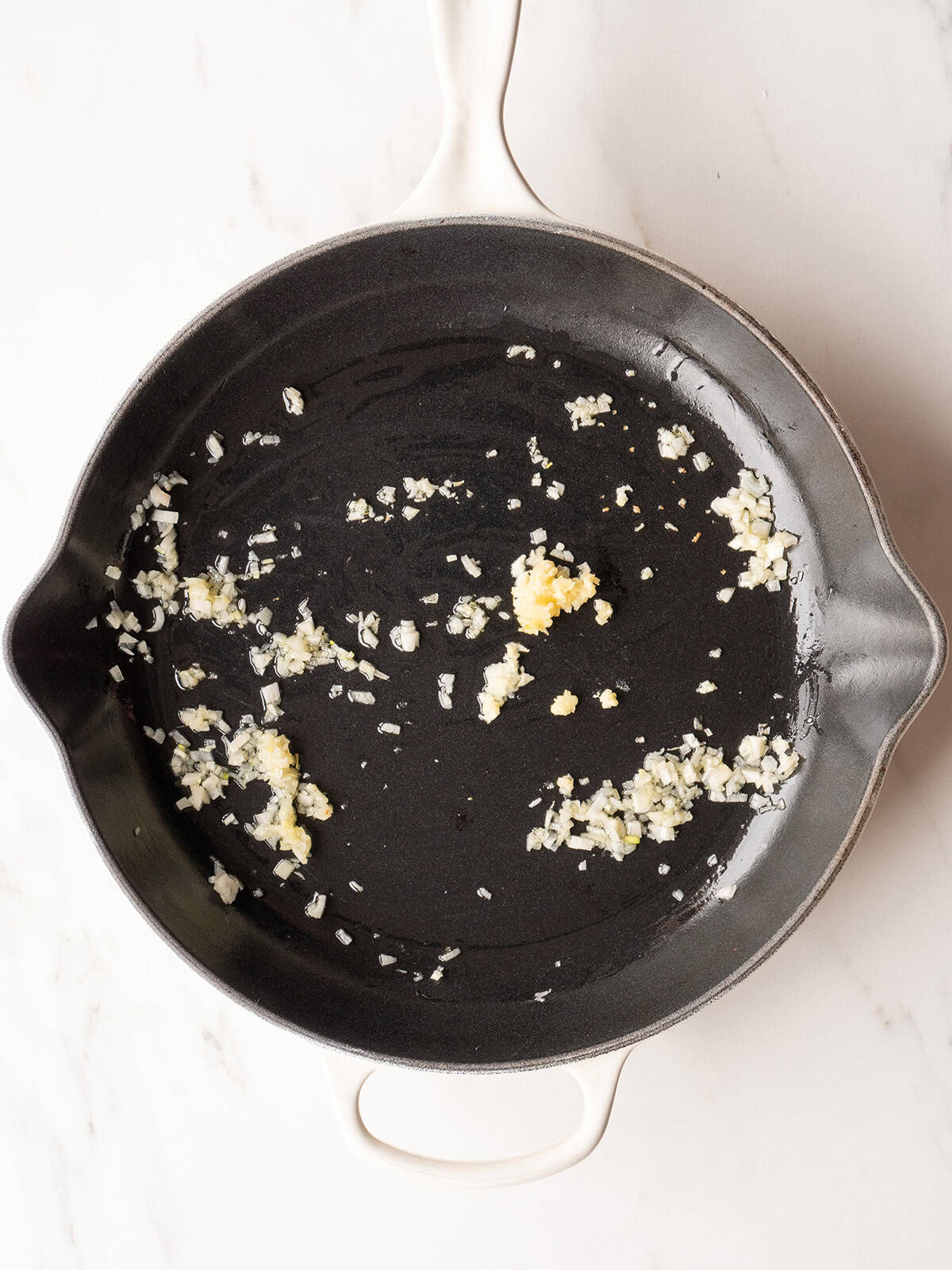 Empty skillet with shallots and garlic