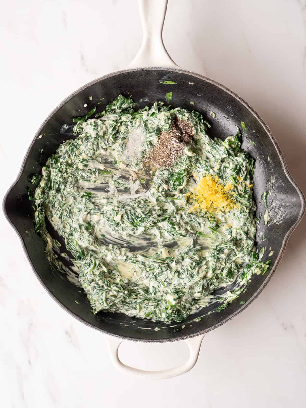 Creamy spinach mixture in skillet