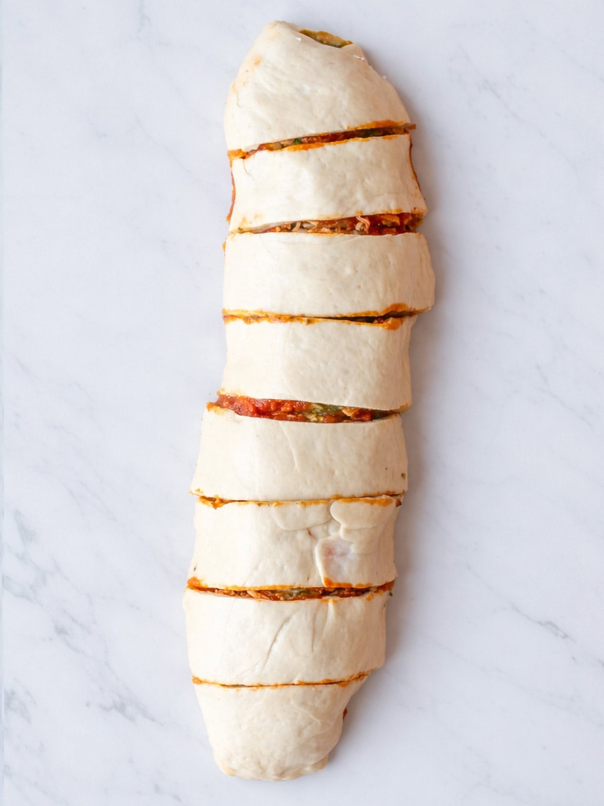 Sliced pizza rolls with tomato filling