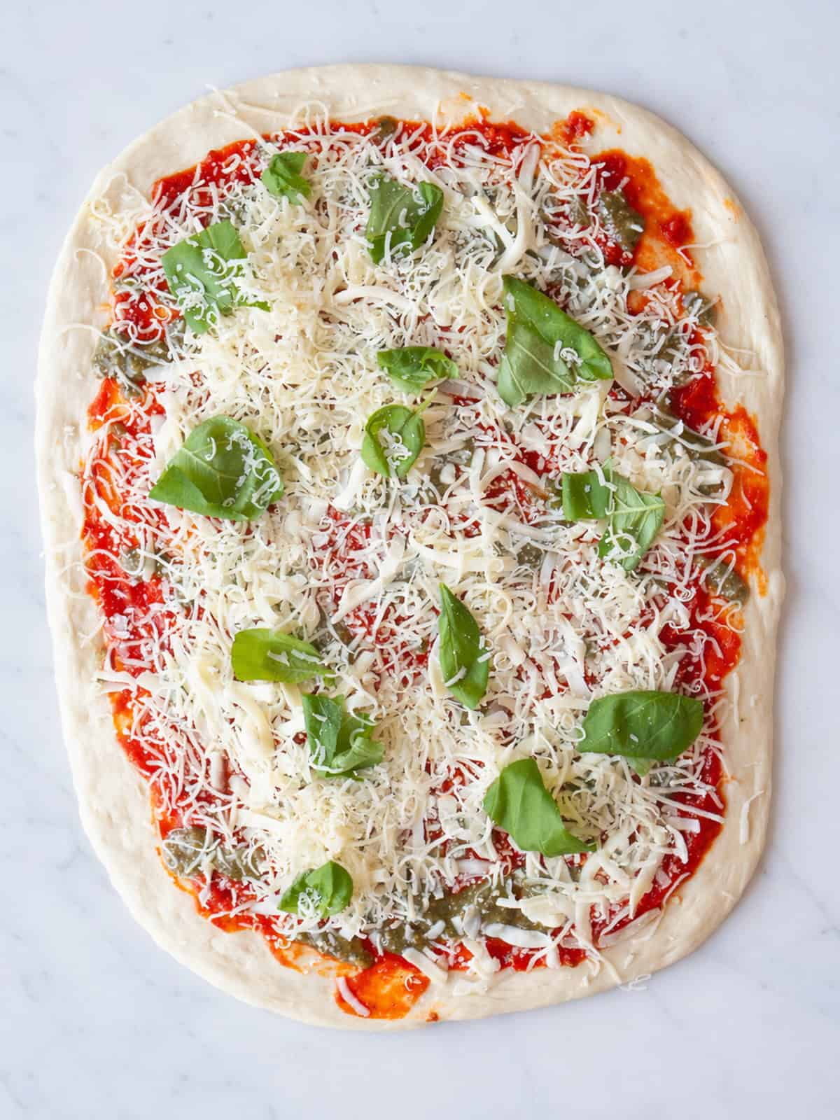 Pizza roll dough topped with sauce and cheese