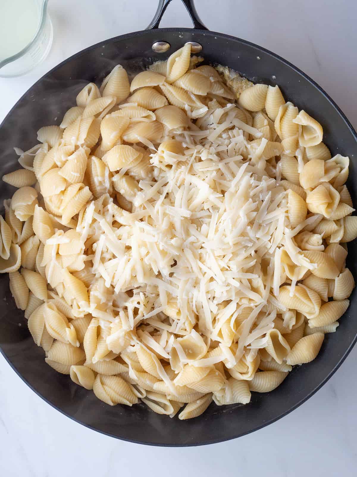 Pasta shells with grated Parmesan cheese