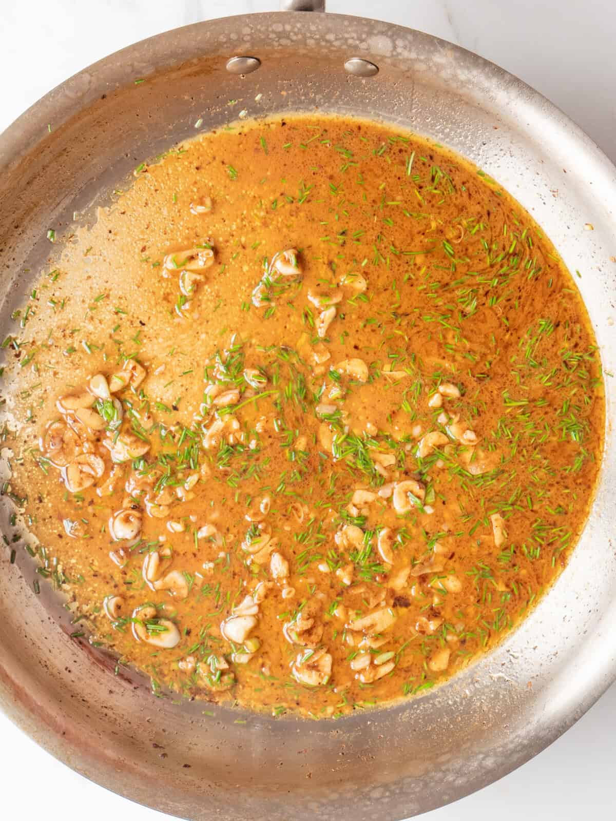 Sauce with herbs and garlic pieces