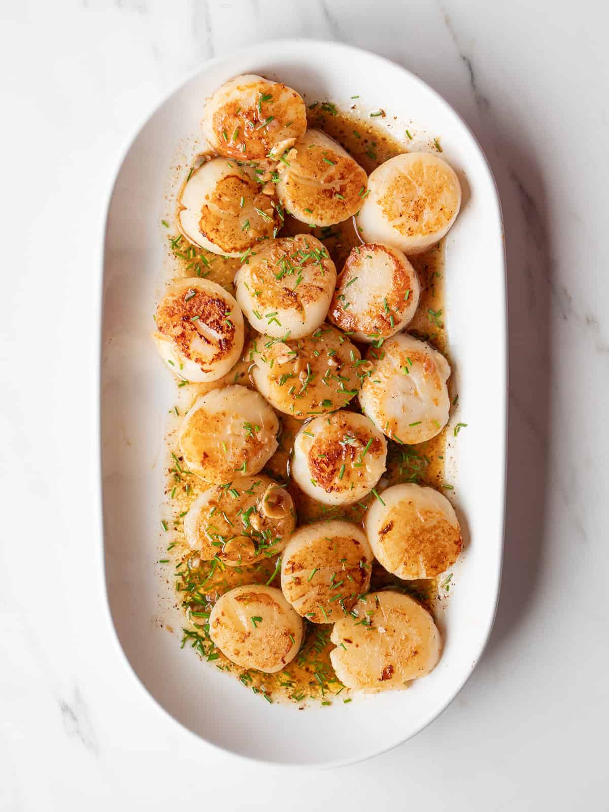 Deliciously cooked scallops with herbs