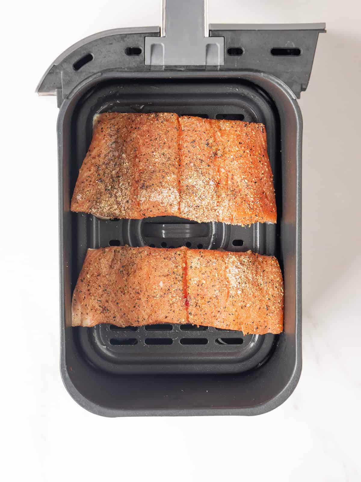 Two salmon fillets in air fryer