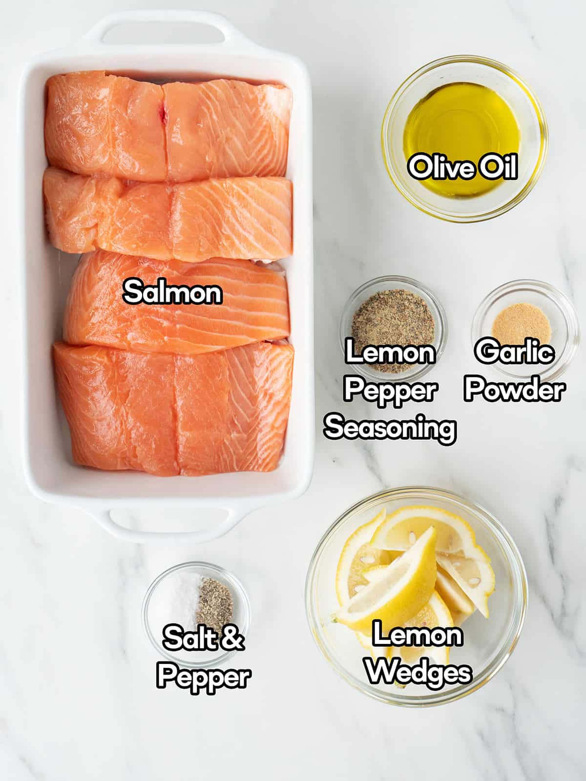 Salmon with seasonings and lemon wedges