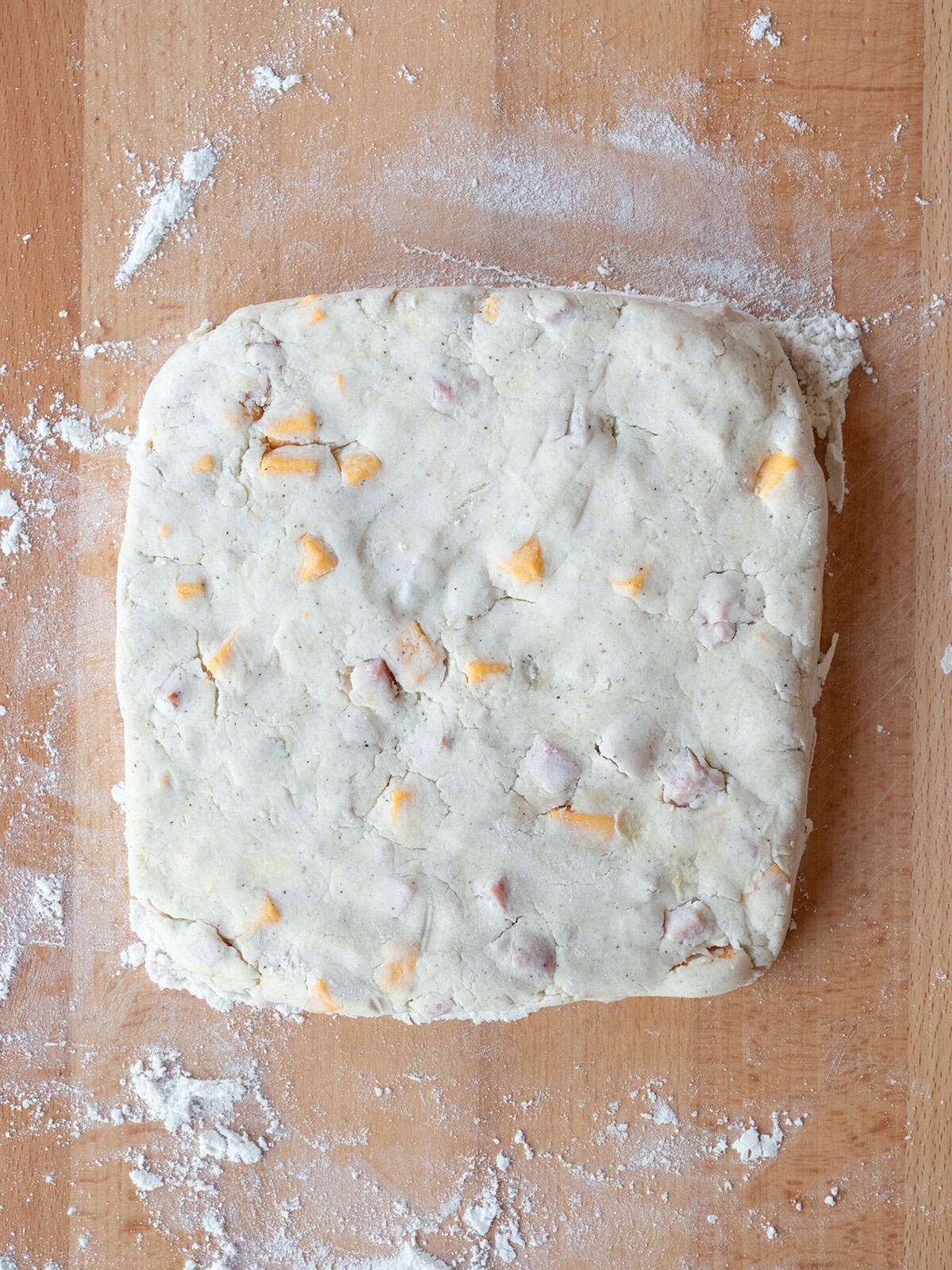 Square dough with cheese and ham