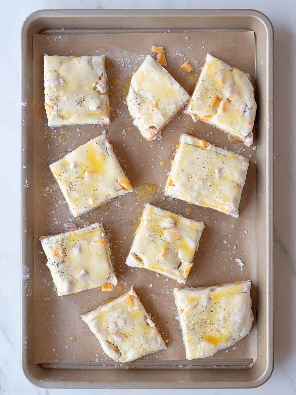 Raw biscuits on a baking tray