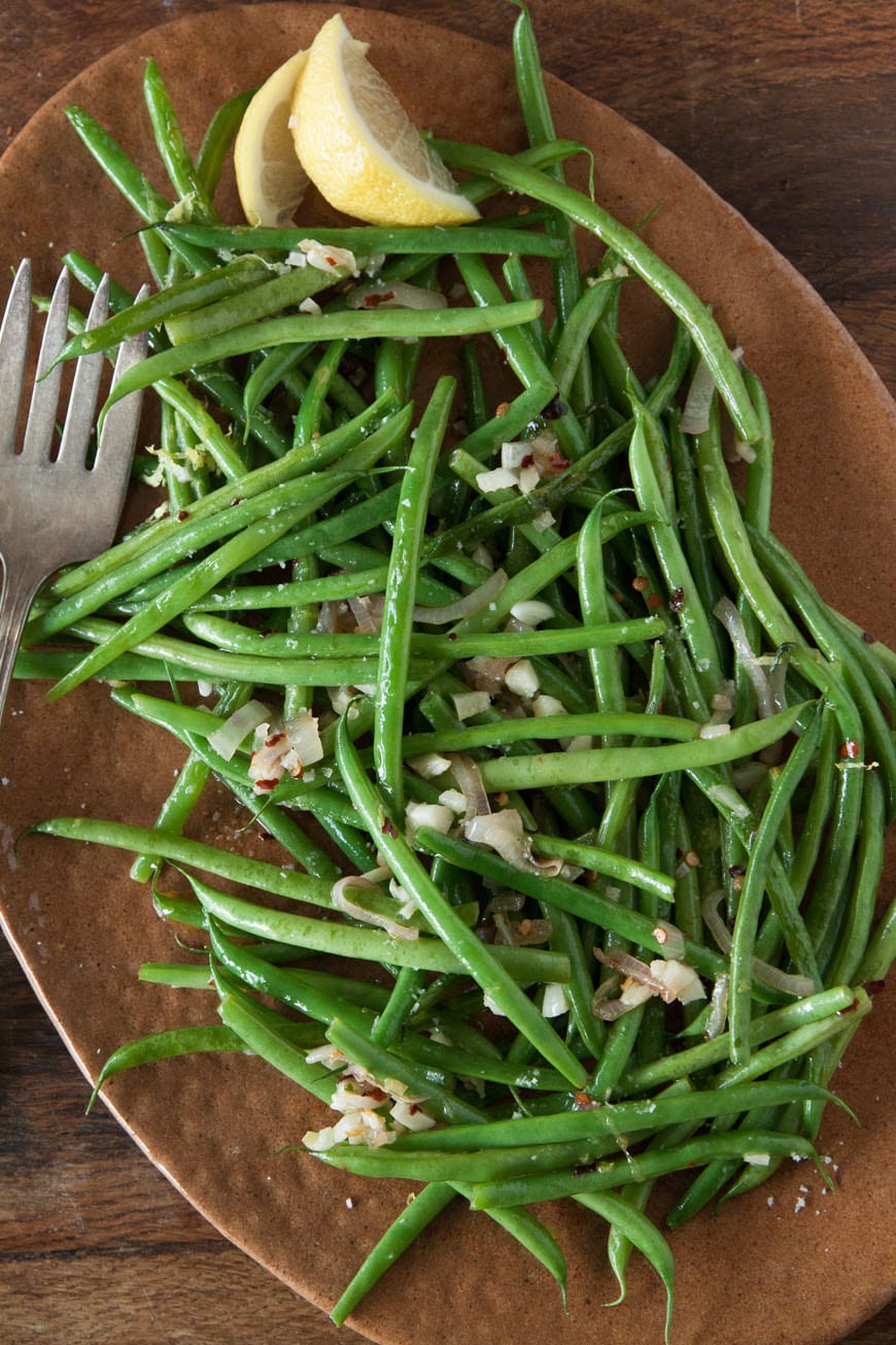Spicy Garlic Green Beans - these are literally the best green beans on the planet! You'll want to snack on them like candy!